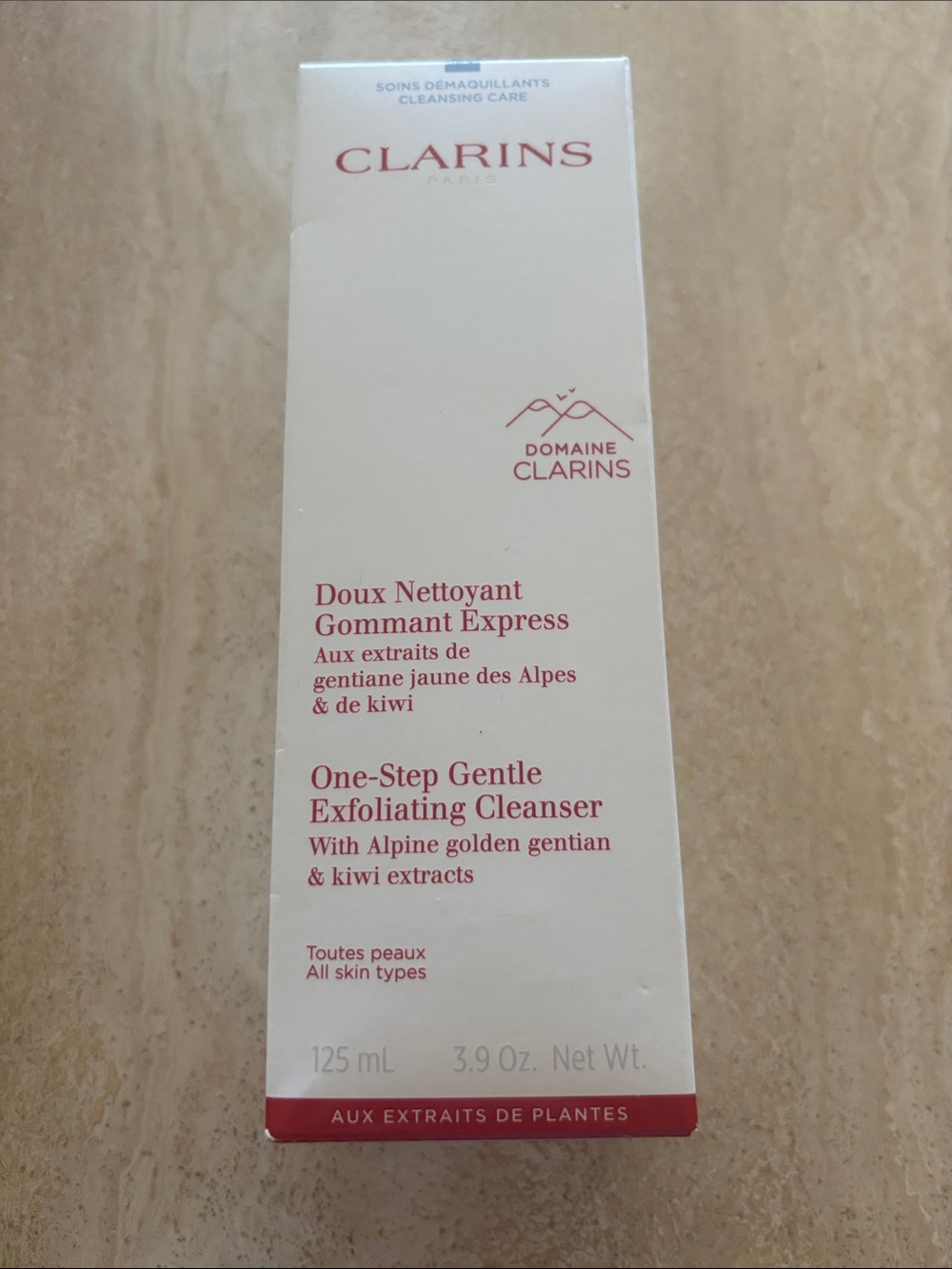 Clarins One-Step Gentle Exfoliating Cleanser — White with Red Text